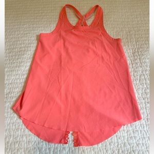 Ivivva (girls Lululemon) size 7 bright coral pink tank. Looser fitting w detail